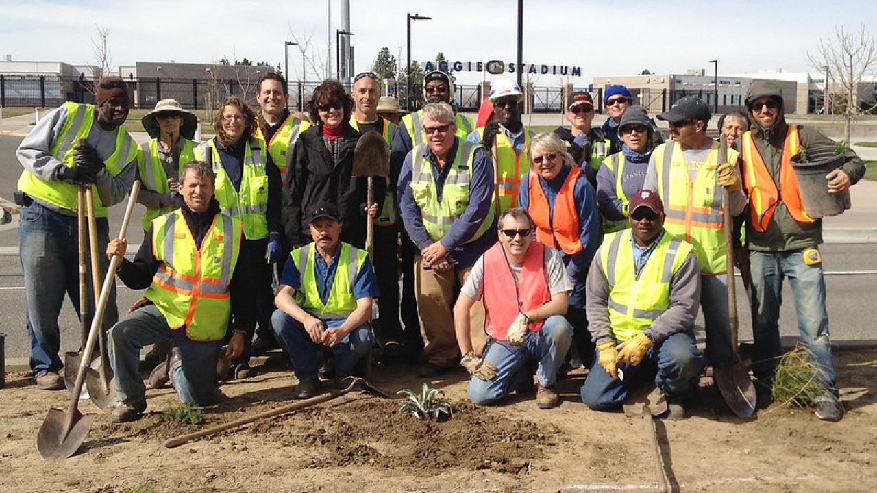 Image of a group of UC Davis Arboretum and Public Garden staff members outdoors at a planting event.