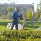 Member of the Grounds crew operates a sprinkler