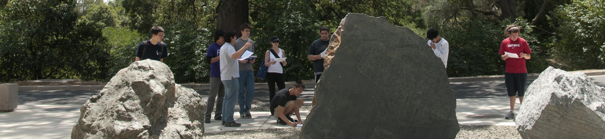 Image of geology students studying the rocks in the UC Davis California Rock Garden.